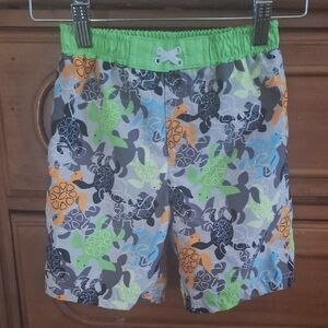Vibrant Green and Orange Dinosaur Pattern Shorts